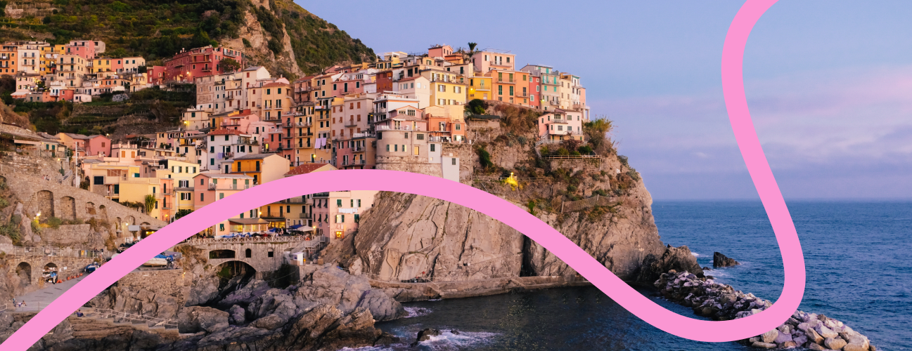An colorful Italian village located on a rock above the sea.