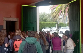 Group of young people at the gate of the university