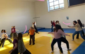 Group of pairs, doing movement activity back to back