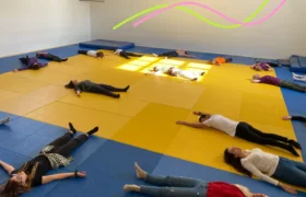 Group of young people lying down on the floor during a relaxation session