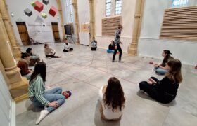 Group of young people sitting in a circle