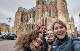 Group selfie in front of a huge church